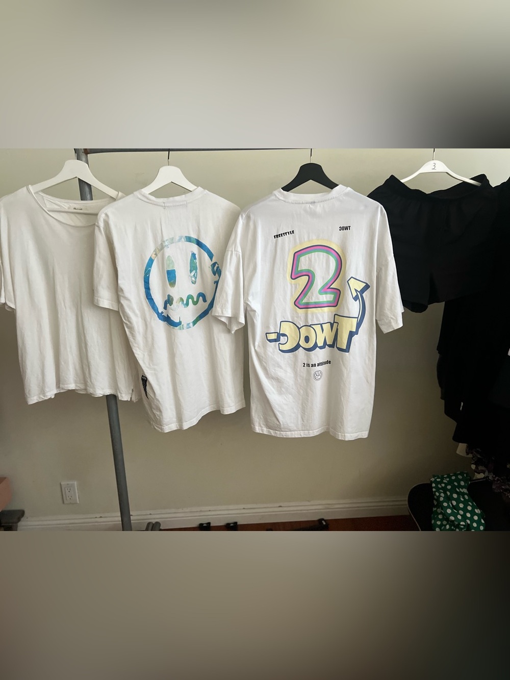 white graphic tee features a colorful "2-DOWT" design on the back with the phras